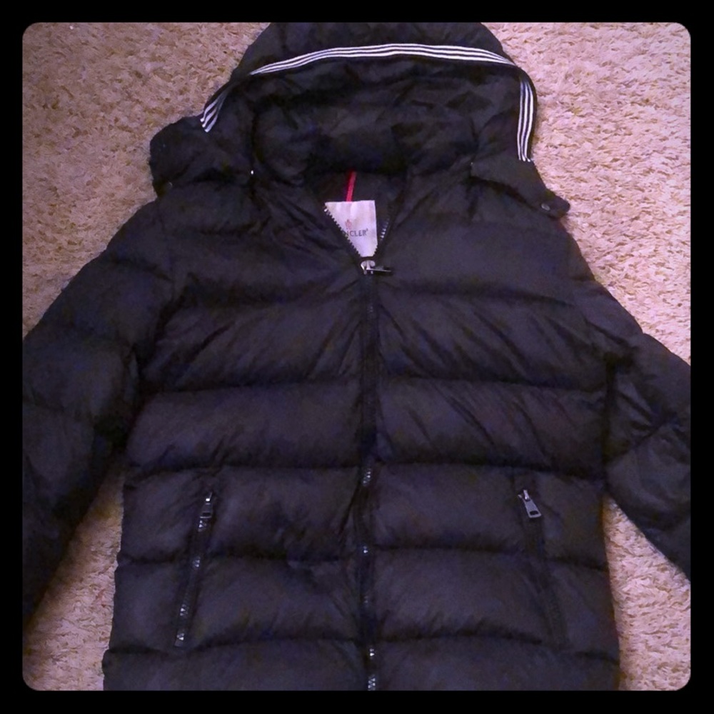 moncler coat size medium fits like a small.